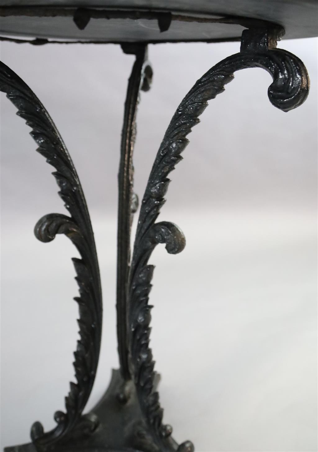 A pair of early Victorian cast iron occasional tables, Diam. 1ft 9in. H.2ft 4in.